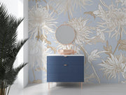 Elegant blue floral wall mural with intricate beige and gold chrysanthemums, styled in a modern bathroom with a navy vanity and round mirror.