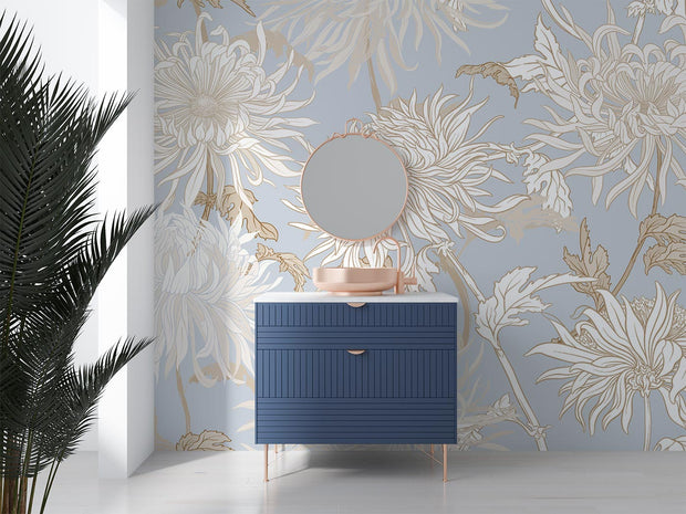 Elegant blue floral wall mural with intricate beige and gold chrysanthemums, styled in a modern bathroom with a navy vanity and round mirror.