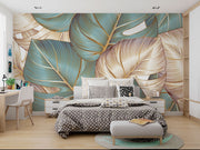 Teal and gold tropical leaf wall mural with oversized botanical patterns and fine-line detailing, perfect for modern, tropical, and boho-inspired interiors.