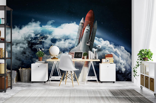 Wall mural of a space shuttle launching into orbit with Earth and clouds in the background; decorating a study.