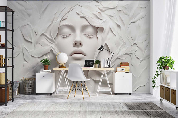 3D Sculptural Face Wall Mural – Elegant Abstract Art Wallpaper Featuring an Ethereal Face with Flowing Leaf Textures in Monochromatic Ivory Tones for Luxury Interiors.