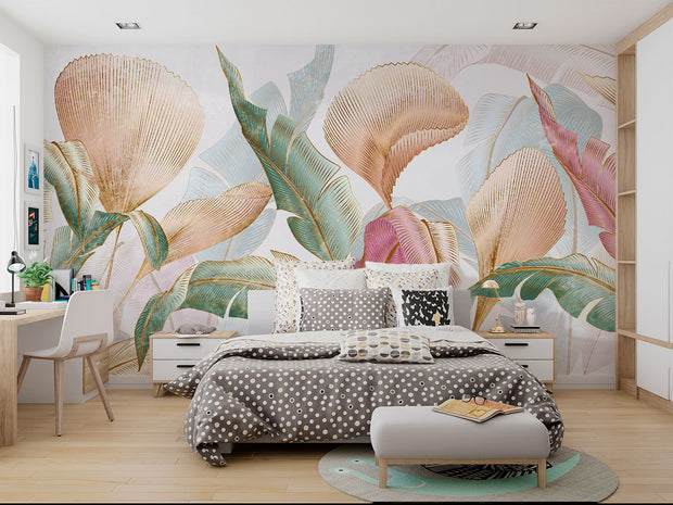 Pastel tropical leaf wall mural with oversized botanical patterns in soft pink, teal, and gold tones, perfect for modern, boho, and tropical-inspired interiors.