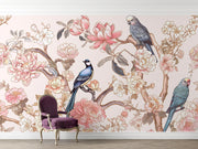 Elegant Chinoiserie wall mural featuring delicate birds, magnolia blossoms, and peonies in soft pastel hues, styled in a living room.