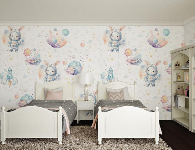 Space themed wall mural with bunnies in astronaut suits, colorful planets, rockets and stars, decorating a cozy kid's bedroom with twin beds and soft pastel decor.