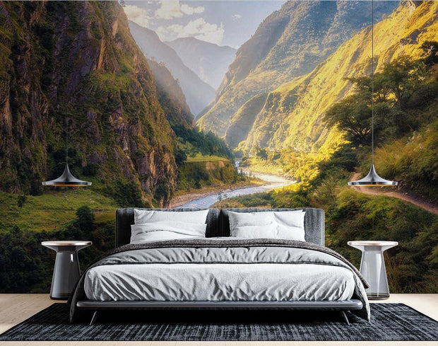 Majestic valley wall mural with green mountains, winding river, and sunlight, perfect for nature-inspired bedroom or living room décor.