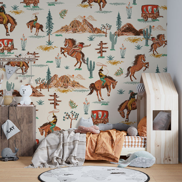 Wild West cowboy wall mural featuring galloping horses, cowboys, cacti, and Western landscapes in a vintage-style wallpaper design.