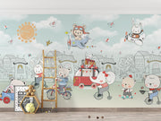 Animal-themed wall mural featuring animals riding bikes, scooters, and driving cars in a whimsical pastel-colored town, decorating a kid's playroom.