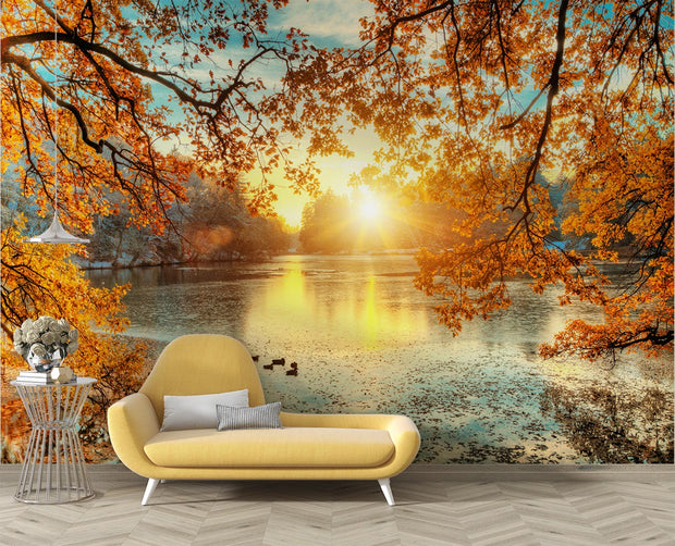 Golden lake wall mural with autumn trees, vibrant sunlight reflecting on the water and a peaceful nature-inspired setting.