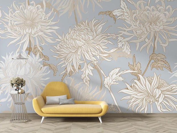 Elegant blue floral wall mural with intricate beige and gold chrysanthemums, styled in a modern living room with a yellow sofa.