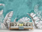 Large white palm leaves on a textured turquoise background in a tropical wall mural, perfect for modern and coastal interiors.