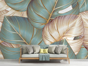 Teal and gold tropical leaf wall mural with oversized botanical patterns and fine-line detailing, perfect for modern, tropical, and boho-inspired interiors.