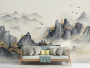 A serene living room featuring a Tranquil Peaks wall mural with misty watercolour mountains and golden foliage. Styled with wooden furniture, it creates a calm, nature-inspired atmosphere.