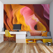 Vibrant Antelope Canyon Wall Mural – Stunning Desert Landscape Wallpaper with Swirling Sandstone Formations in Fiery Orange, Golden Yellow, and Soft Pink Tones.