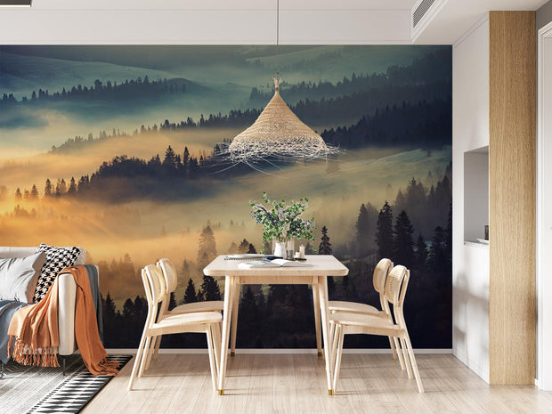 Sunrise hills wall mural featuring rolling forested hills, golden morning light and soft mist, creating a peaceful and elegant interior backdrop.