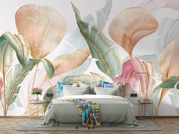 Pastel tropical leaf wall mural with oversized botanical patterns in soft pink, teal, and gold tones, perfect for modern, boho, and tropical-inspired interiors.