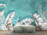 Large white palm leaves on a textured turquoise background in a tropical wall mural, perfect for modern and coastal interiors.