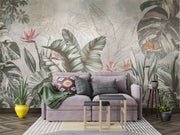 Elegant tropical wall mural with monstera leaves and birds of paradise flowers in sage green and coral, styled in modern living room.