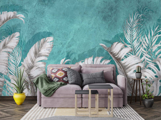 Large white palm leaves on a textured turquoise background in a tropical wall mural, perfect for modern and coastal interiors.