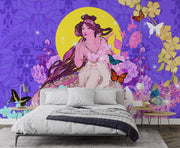 Whimsical wall mural with a muse surrounded by butterflies, vibrant florals, and a yellow moon against a purple background; decorating a bedroom.