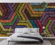 Modern rainbow geometric wall mural with textured chevron pattern, styled in minimalist bedroom.