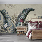 Tropical elegance wall mural featuring oversized banana leaves, bird of paradise flowers, and a hummingbird in muted tones for a luxurious interior.