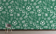 Green soccer-themed wall mural with motivational words, soccer balls and dynamic graphics; decorating  kids' room.