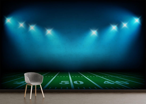 Night Lights Wall Mural featuring a green football field under bright stadium lights, ideal for sports-themed decor.