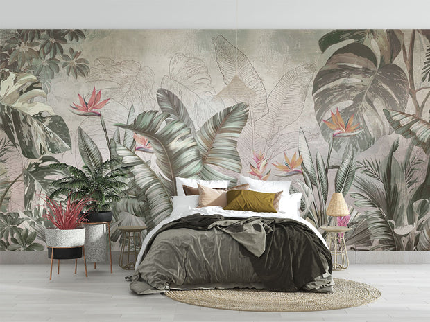 Elegant tropical wall mural with monstera leaves and birds of paradise flowers in sage green and coral, styled in modern bedroom.