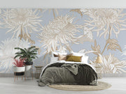 Elegant blue floral wall mural with intricate beige and gold chrysanthemums, styled in a modern bedroom.