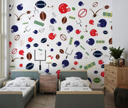 Vibrant football wall mural with colorful helmets, footballs and goalposts; decorating kid's bedroom.