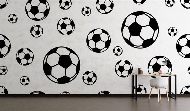 Modern black and white soccer ball wall mural with bold soccer patterns;  decorating home office.