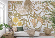 Art Nouveau botanical wall mural with flowing floral patterns in beige, sage green, and gold tones, styled in a cosy living space.