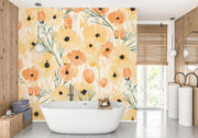 Bright poppy floral wall mural with bold yellow, orange, and green accents in a bathroom.