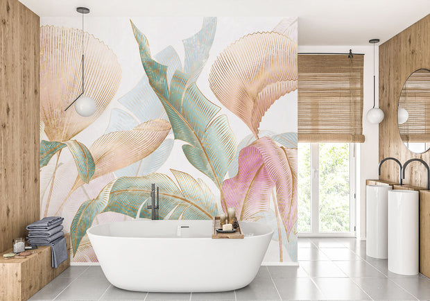 Pastel tropical leaf wall mural with oversized botanical patterns in soft pink, teal, and gold tones, perfect for modern, boho, and tropical-inspired interiors.