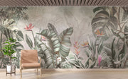 Elegant tropical wall mural with monstera leaves and birds of paradise flowers in sage green and coral, styled in modern living room.