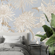 Elegant blue floral wall mural with intricate beige and gold chrysanthemums, styled in a modern bedroom.