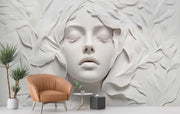 3D Sculptural Face Wall Mural – Elegant Abstract Art Wallpaper Featuring an Ethereal Face with Flowing Leaf Textures in Monochromatic Ivory Tones for Luxury Interiors.