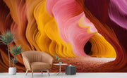 Vibrant Antelope Canyon Wall Mural – Stunning Desert Landscape Wallpaper with Swirling Sandstone Formations in Fiery Orange, Golden Yellow, and Soft Pink Tones.