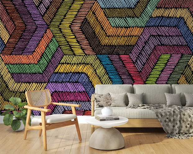 Modern rainbow geometric wall mural with textured chevron pattern, styled in minimalist living room with grey sofa.