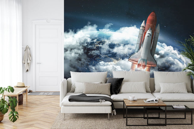 Wall mural of a space shuttle launching into orbit with Earth and clouds in the background; decorating a living room.