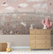 Enchanted woodland animal wall mural featuring rabbits, deer, birds, and wildflowers in a cozy children’s room with modern decor.