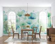 Watercolor floral wall mural featuring soft blue and green flowers in a delicate, hand-painted style, with a modern living room.