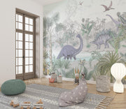 Jungle dinosaur wall mural and wallpaper featuring Stegosaurus, Brontosaurus, lush jungle plants and volcanoes; styled in a playful kid's room.