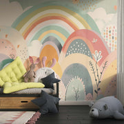 Colorful rainbow hills wall mural with soft pastel tones, whimsical hand-painted patterns, and playful botanical details – perfect for a kids’ bedroom or nursery decor.